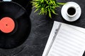 Desk of musician or dj with vynil records and blank paper for songwriter work on dark background top view mockup Royalty Free Stock Photo