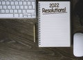 Desktop flat lay with notepad for 2022 new year resolutions Royalty Free Stock Photo