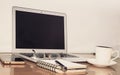 Desk with open notebook, mobile phone, eye glasses, pen and a cup of coffee. Top view with copy space. Business still life concept Royalty Free Stock Photo