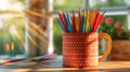 Desk organizer Cup filled with colored pencils on wood table Royalty Free Stock Photo
