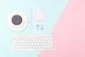 Desk and pink stationery on on pastel color background. Copy spa