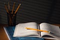 Desk with school book in night Royalty Free Stock Photo