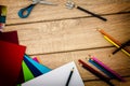 Desk with sharpener, compass, construction paper and colored pencils Royalty Free Stock Photo