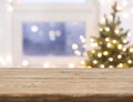 Desk space in front of defocused window with christmas tree Royalty Free Stock Photo