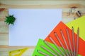 Desk with stationery, colored paper, colour pencils, pencil sharpener, ruler. Top view mock up back to school with copy space. Royalty Free Stock Photo