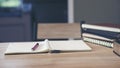 Desk for student education concept. Book for study for exam. Stack of book, diary and pen placed on white School table in the Royalty Free Stock Photo