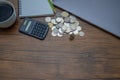 On the desk, there is a silver coin placed on it Royalty Free Stock Photo