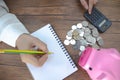 On the desk, there is a silver coin placed on it Royalty Free Stock Photo