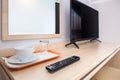 Desk with TV remote control Royalty Free Stock Photo