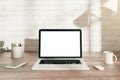 Desk with white laptop display Royalty Free Stock Photo