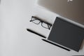 Desk White office desk table with a lot of things tablet, laptop ,smartphone and coffee cup notepad . Top view with copy space, Royalty Free Stock Photo