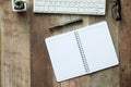 Desk work with computer keyboard, glasses and notebook Royalty Free Stock Photo