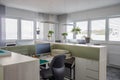 Desks are located in a modernly furnished office