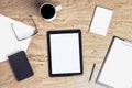 Desktop with blank tablet screen Royalty Free Stock Photo