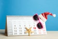Christmas cap and desktop calendar Royalty Free Stock Photo