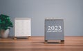 Desktop calendar for 2023 on a desk beige and white background. plans and goals on next year. Two Calendars 2023 on office table.