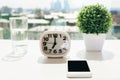 Desktop with clock and phone Royalty Free Stock Photo