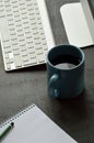 Desktop computer, cup of coffee and note pad on the office desk Royalty Free Stock Photo