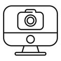 Desktop computer displaying camera icon for online photography concept