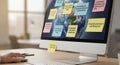 Desktop computer displaying earth with sticky notes containing creative prompts Royalty Free Stock Photo