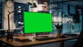 Desktop Computer with Mock-up Green Screen Dsiplay Standing on the Wooden Desk in the Creative Cozy Royalty Free Stock Photo