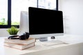 Desktop computer mockup on desk at home office, mock up display screen blank for template minimal style. Royalty Free Stock Photo