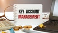 Desktop with documents, calculator and notebook. Inscription KEY ACCOUNT ANAGEMENT Royalty Free Stock Photo