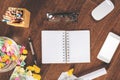 Desktop with empty notepad and objects Royalty Free Stock Photo