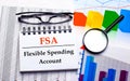 On the desktop are glasses, a magnifying glass, color charts and a white notebook with the text FSA Flexible Spending Account.