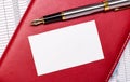 The desktop has reports, a burgundy notepad, a fountain pen, and a white blank card with space to insert text. Business concept Royalty Free Stock Photo