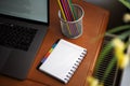 Desktop with laptop, notepad with pencils Royalty Free Stock Photo