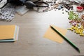 Desktop of a medical worker. Scattered pills of various shapes in color, a medical tonometer and paper with a pencil Royalty Free Stock Photo