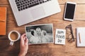 Desktop mix on a wooden office table. Royalty Free Stock Photo