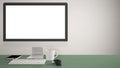 Desktop mockup, template, computer on green pantone colored work desk with blank screen, keyboard mouse and notepad with pens and
