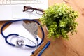 On the desktop, notebook paper and stethoscope glasses