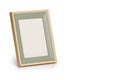 Desktop photo frame, Vertical standing brown wooden picture frame on white background