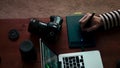 The desktop of a photographer or graphic designer. Aesthetic Workspace in Asian Cafe for Traveling Photographer