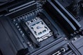 Desktop processor with applied thermal paste installed on motherboard socket, computer cooling preparation and high performance pc Royalty Free Stock Photo