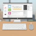 A desktop setup includes a flat-screen computer monitor displaying an interface with Royalty Free Stock Photo