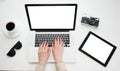 Desktop top view, male hands typing on a laptop