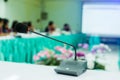 Desktop wireless Conference microphones with blurry business group in a meeting room, microphone on the desk in meeting room with