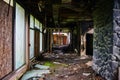 Desolate Abandoned Hotel Hallway with Debris and Decay, Eye-Level View