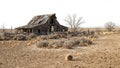 Desolate farmstead with dried landscape dilapidated barn and rolling tumbleweed Royalty Free Stock Photo