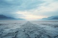 Desolate frozen desert under pale sun Crust of snow cracked in wind. Clear bright sky snowy mountains on horizon Winter landscape Royalty Free Stock Photo