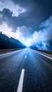 Desolate Highway Stretch Under Dramatic Stormy Clouds and Foggy Forest Scenery Royalty Free Stock Photo