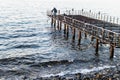 Desolated Dock On Sunset With Calm Sea