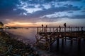 Desolated Dock On Sunset With Calm Sea