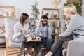 Unhappy married couple, sad, depressed man and woman meeting with doctor, psychologist to solve family problem. Royalty Free Stock Photo