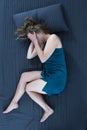 Despair woman lying in bed