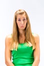 Despair young woman in green tanktop